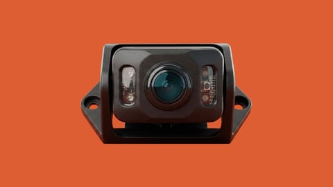 Black vehicle dash camera with blue lens and LED lights mounted on orange background